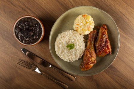 Photo for Executive dish. Roast chicken, rice, beans and mayonnaise salad. - Royalty Free Image