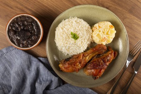 Photo for Executive dish. Roast chicken, rice, beans and mayonnaise salad. - Royalty Free Image