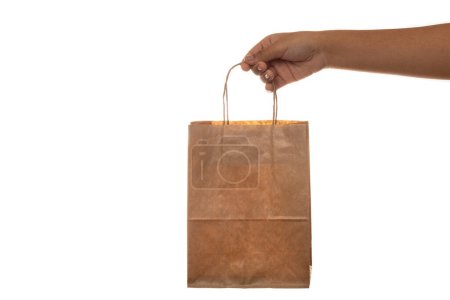 Photo for Holding paper shopping bag on white background. - Royalty Free Image