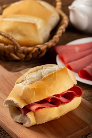 Photo for Mortadella bread sandwich. Mortadella sandwich typical of Brazil. - Royalty Free Image