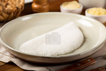 Photo for Tapioca with butter on the table. Brazilian tapioca. - Royalty Free Image
