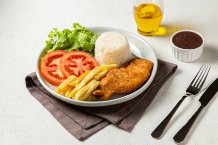 Photo for Executive dish with breaded fillet, rice, beans and salad. - Royalty Free Image
