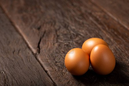 Photo for Brown chicken eggs rises on the table. - Royalty Free Image