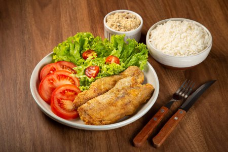 Photo for Fried fish with salad. - Royalty Free Image