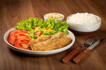 Photo for Fried fish with salad. - Royalty Free Image