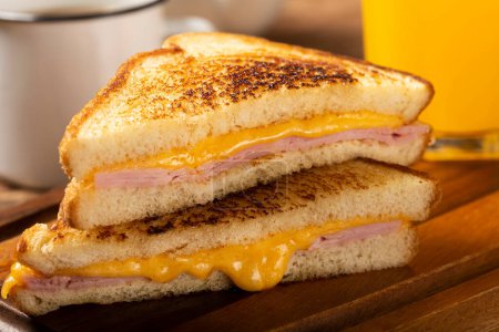Photo for Grilled ham and cheese. Sandwich with cheese and ham on grill. - Royalty Free Image