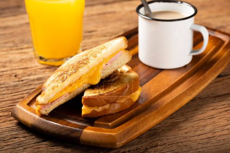 Photo for Grilled ham and cheese. Sandwich with cheese and ham on grill. - Royalty Free Image