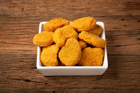 Photo for Fried chicken nuggets with ketchp and rose sauce. - Royalty Free Image