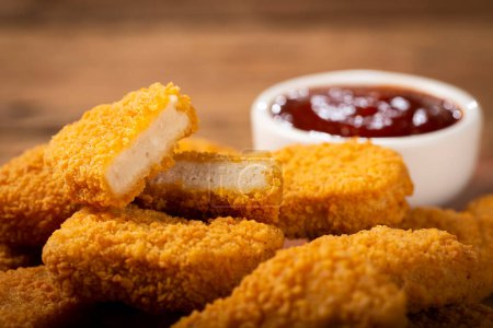 Photo for Fried chicken nuggets with ketchp and rose sauce. - Royalty Free Image