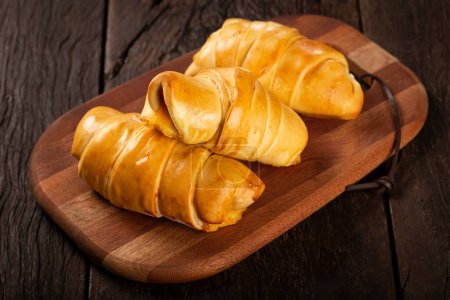 Photo for Traditional fresh baked croissants on the table. - Royalty Free Image
