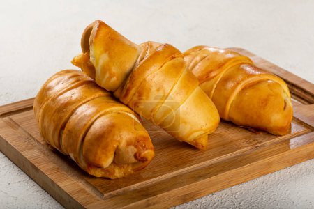 Photo for Traditional fresh baked croissants on the table. - Royalty Free Image