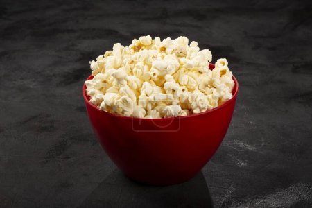 Photo for Bowl with salted popcorn sore the table. - Royalty Free Image