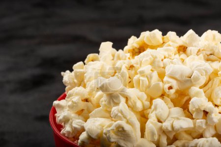 Photo for Bowl with salted popcorn sore the table. - Royalty Free Image