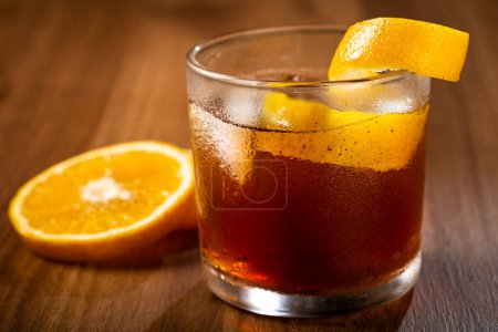 Photo for Negroni cocktail with orange, on wooden background. - Royalty Free Image