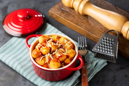 Photo for Gnocchi with tomato sauce and grated Parmesan cheese. - Royalty Free Image
