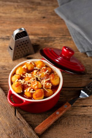 Photo for Gnocchi with tomato sauce and grated Parmesan cheese. - Royalty Free Image