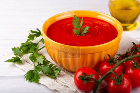 Photo for Delicious homemade tomato soup in bowl. - Royalty Free Image