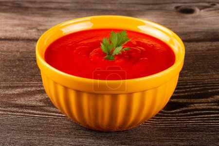 Delicious homemade tomato soup in bowl.
