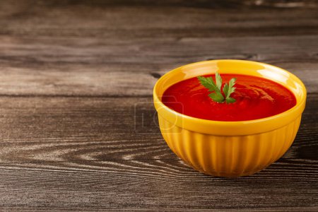 Photo for Delicious homemade tomato soup in bowl. - Royalty Free Image