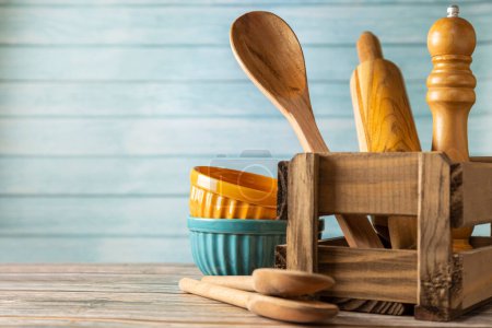 Photo for Kitchen utensils on wooden background. - Royalty Free Image