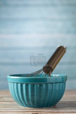 kitchen utensils on wooden background.