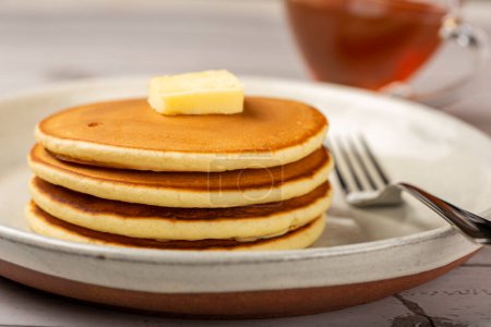 Photo for Delicious pancakes with butter and honey. - Royalty Free Image