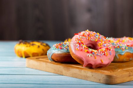 Photo for Delicious assorted colorful donuts on the table. - Royalty Free Image