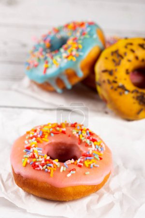 Photo for Delicious assorted colorful donuts on the table. - Royalty Free Image
