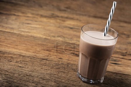 Photo for Glass with chocolate on the table. - Royalty Free Image