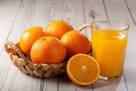 Photo for Glass with orange juice on the table. - Royalty Free Image