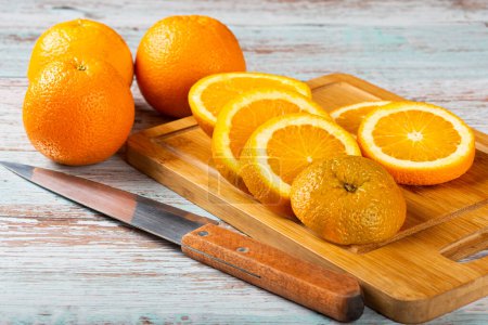 Photo for Sliced fresh oranges on the table. - Royalty Free Image