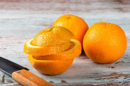 Photo for Sliced fresh oranges on the table. - Royalty Free Image