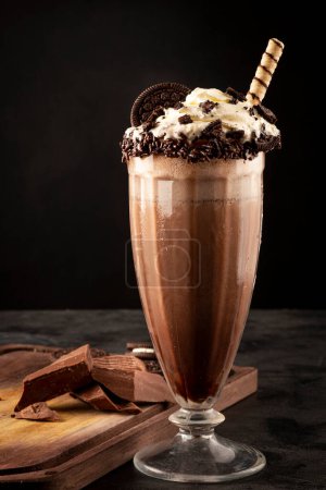 Photo for Chocolate milkshake with pieces of chocolate chip cookies. - Royalty Free Image