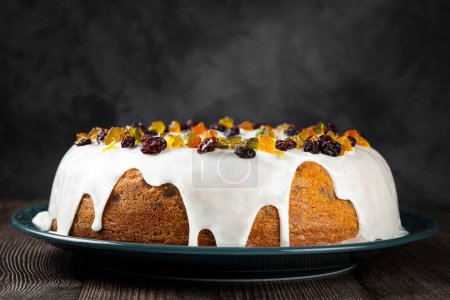 Christmas cake with fondant and candied fruit.
