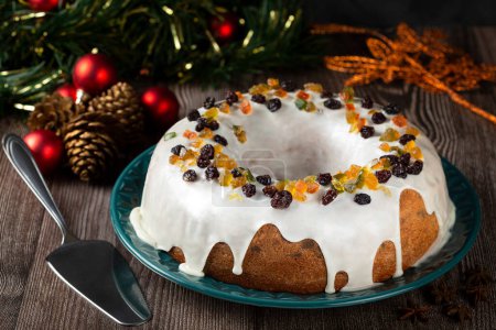 Christmas cake with fondant and candied fruit.