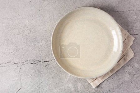 Photo for Empty plate on the slate table. Top view of the image. - Royalty Free Image