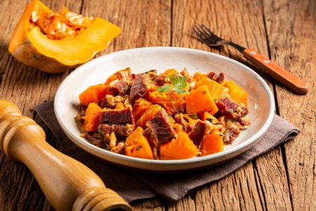 Photo for Dried meat with pumpkin. Tipical brazilian dish. - Royalty Free Image