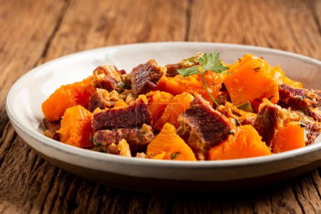 Dried meat with pumpkin. Tipical brazilian dish.
