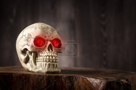 Photo for Halloween catrine skull on an old wooden table in rustic background. - Royalty Free Image