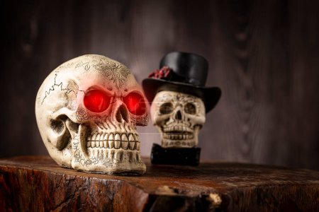 Halloween catrine skull on an old wooden table in rustic background.