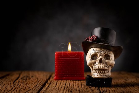Photo for Halloween catrine skull on an old wooden table in black background. - Royalty Free Image