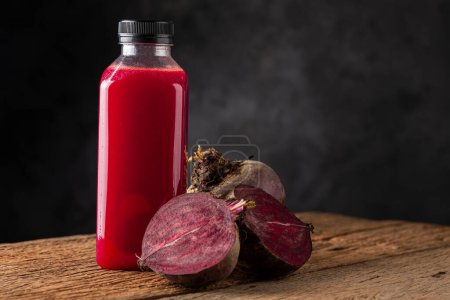 Photo for Red beet juice in plastic bottle. - Royalty Free Image