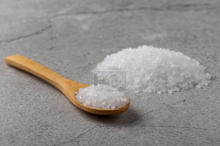 Handful of coarse salt on the table.