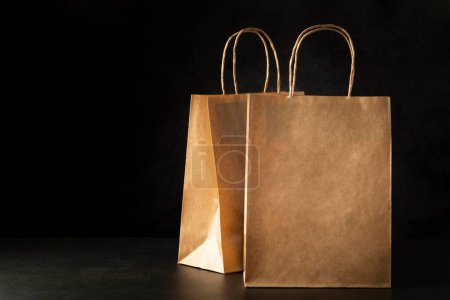 Photo for Paper bags on dark background. - Royalty Free Image