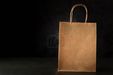 Photo for Paper bag on dark background. - Royalty Free Image