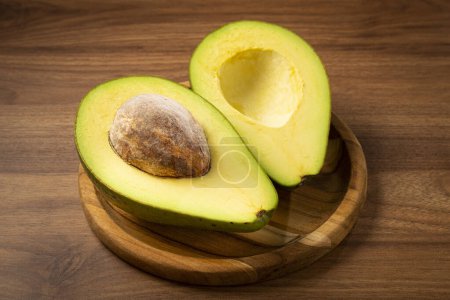 Photo for Ripe fresh avocado on the table. - Royalty Free Image