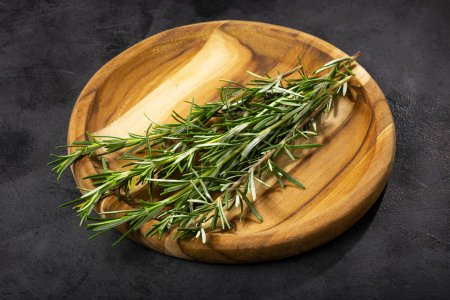 Photo for Fresh rosemary herb on the table. - Royalty Free Image