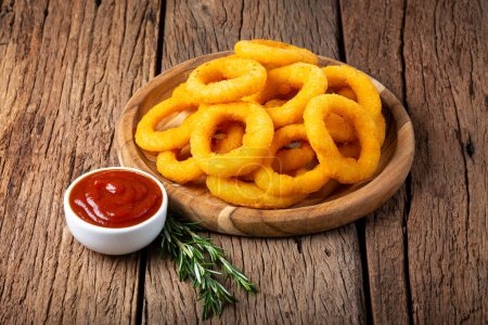 Crispy onion rings with ketchup.