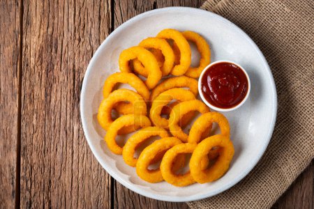 Photo for Crispy onion rings with ketchup. - Royalty Free Image