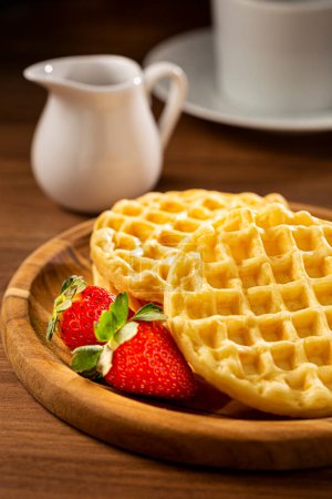 Photo for Delicious waffles. Plate with baked waffles on the table. - Royalty Free Image